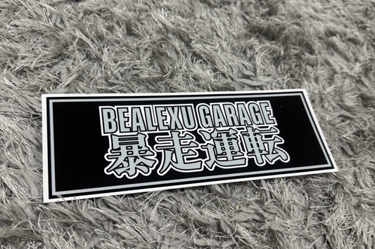 Rectangular sticker with text on a textured gray surface